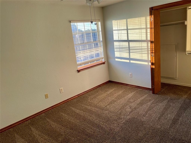 unfurnished bedroom with ceiling fan and carpet floors