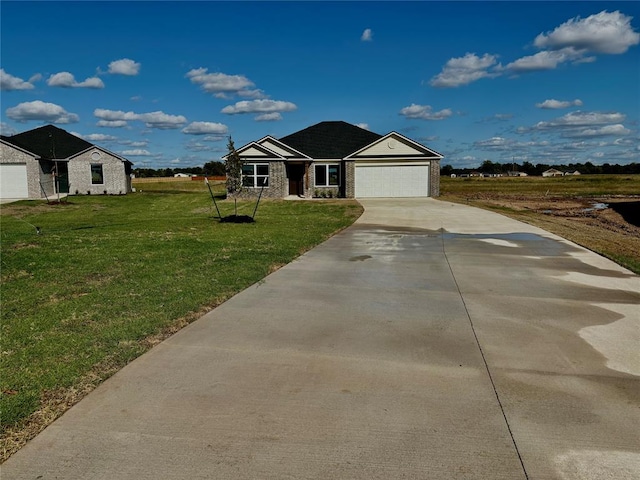 view of front of property with a front lawn and a garage