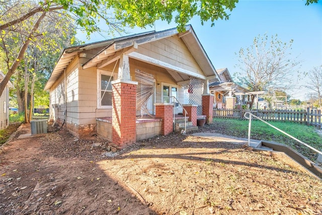 exterior space with a porch and central AC