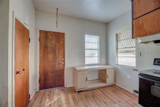 kitchen featuring white range with electric cooktop and light wood-type flooring