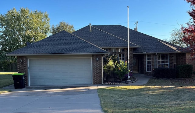 view of front facade with a garage and a front yard