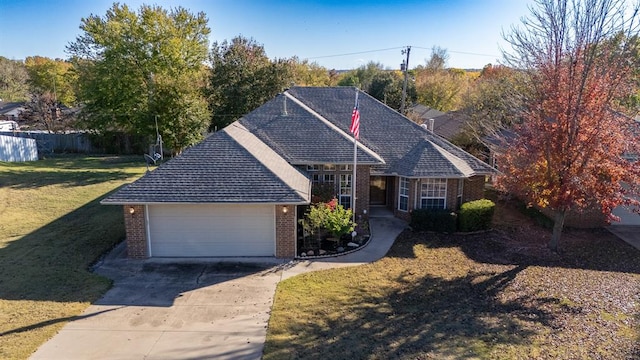 view of front of home featuring a front yard and a garage