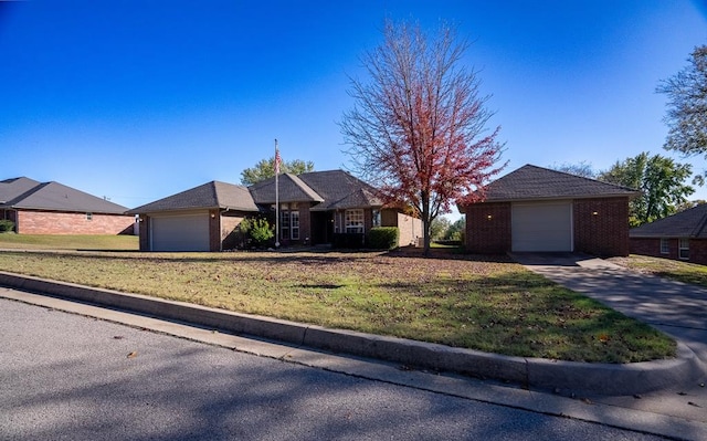 ranch-style house with a garage and a front yard