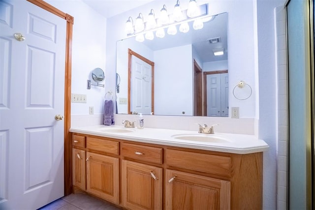 bathroom with tile patterned flooring and vanity