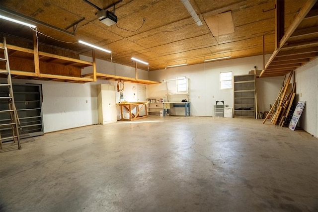 interior space featuring a workshop area and a garage door opener