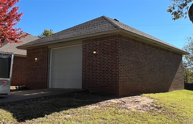 view of side of property with an outbuilding and a garage