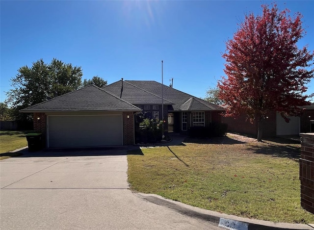 single story home with a front yard and a garage