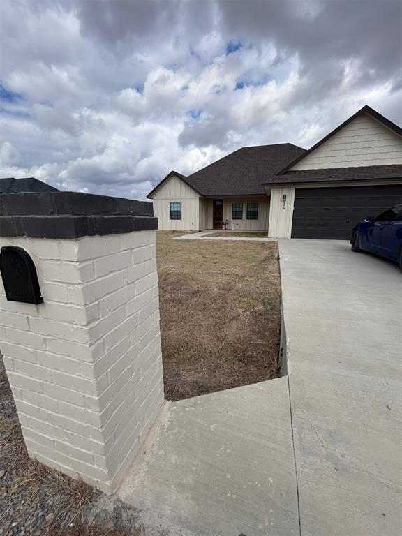 34 Bull Run, Calera, OK 74730 - single story home with a garage and driveway