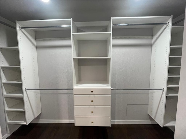 walk in closet featuring dark hardwood / wood-style floors