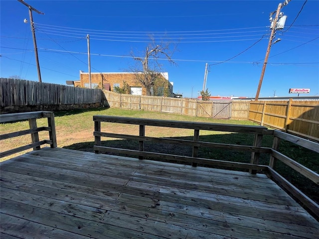 wooden terrace with a yard