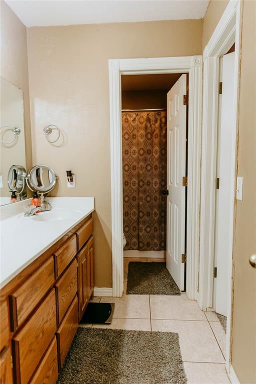 bathroom featuring tile patterned flooring and vanity