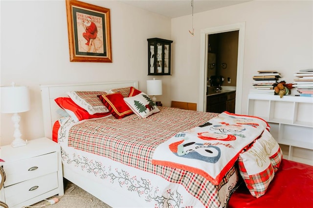 carpeted bedroom featuring connected bathroom