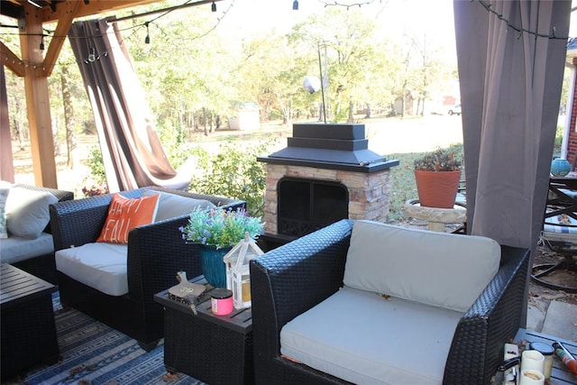 view of patio / terrace with an outdoor stone fireplace