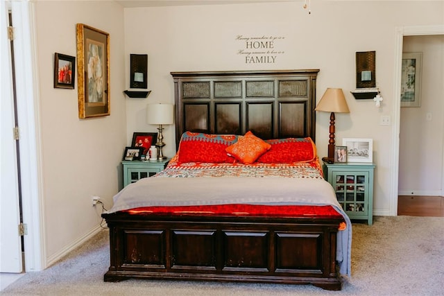 bedroom with light colored carpet