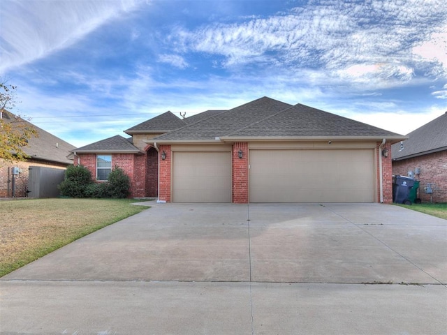 single story home with a garage and a front yard