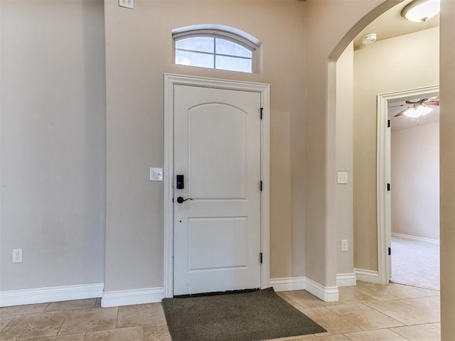 entrance foyer featuring ceiling fan and light tile patterned floors