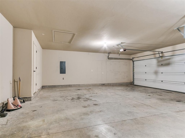 garage featuring electric panel and a garage door opener