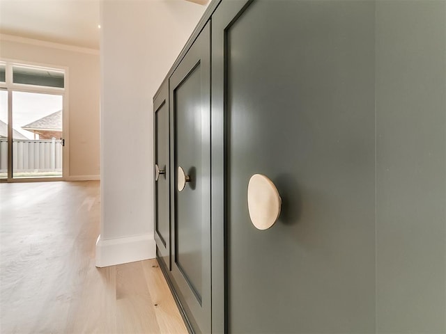 16413 Burgundy E Dr, Edmond, OK 73013 - hall featuring baseboards, ornamental molding, and light wood finished floors