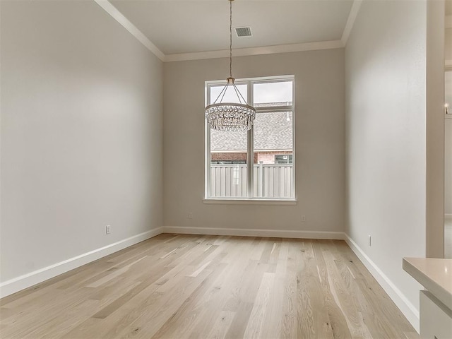 16413 Burgundy E Dr, Edmond, OK 73013 - unfurnished dining area featuring crown molding, a chandelier, baseboards, and light wood-style flooring