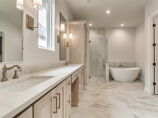 16413 Burgundy E Dr, Edmond, OK 73013 - full bath with a shower stall, double vanity, a soaking tub, recessed lighting, and marble finish flooring