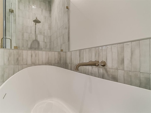 16413 Burgundy E Dr, Edmond, OK 73013 - detailed view of a soaking tub and tiled shower