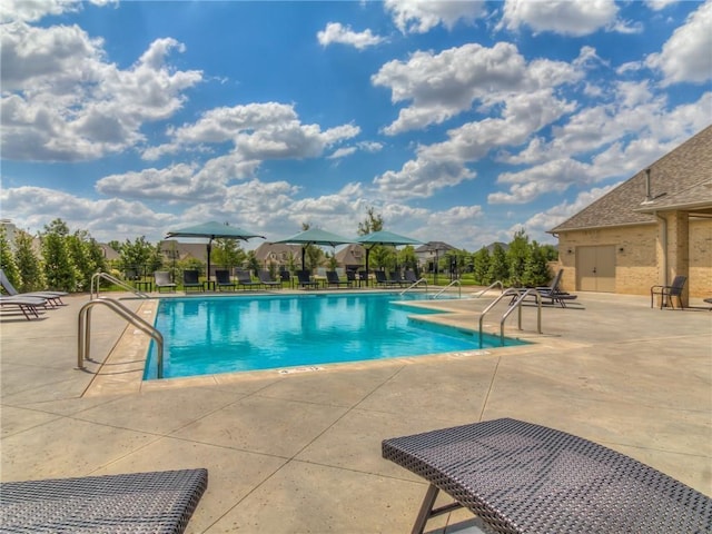 16413 Burgundy E Dr, Edmond, OK 73013 - community pool featuring a patio