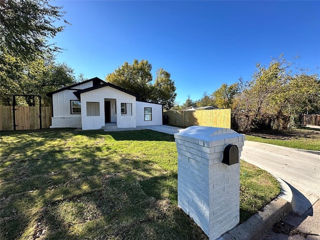 1212 SW 22nd St, Oklahoma City, OK 73109 - view of front facade with a front lawn
