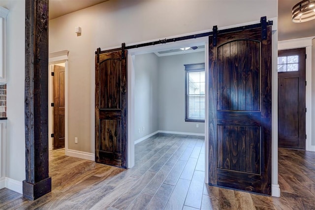 entryway featuring hardwood / wood-style flooring and a barn door