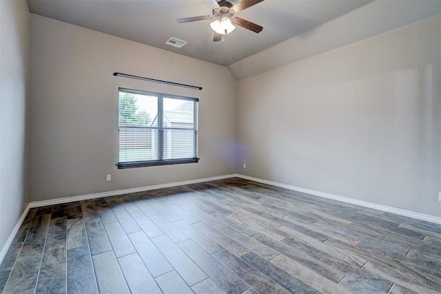 spare room with hardwood / wood-style flooring, ceiling fan, and lofted ceiling