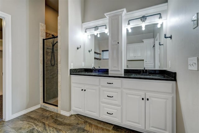 bathroom featuring vanity and a shower with shower door