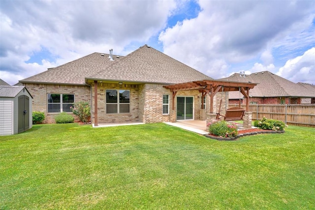 back of property featuring a patio area, a storage shed, a pergola, and a yard