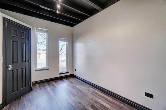 foyer with dark hardwood / wood-style floors