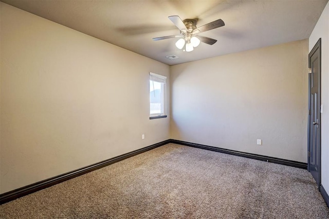 carpeted empty room featuring ceiling fan