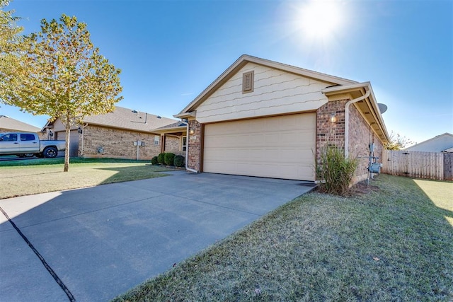 single story home with a front yard and a garage