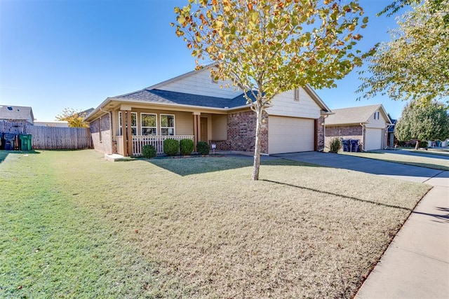 view of front of property with covered porch, a garage, brick siding, driveway, and a front lawn