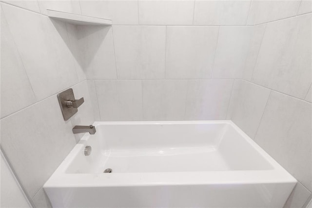 bathroom with a tub