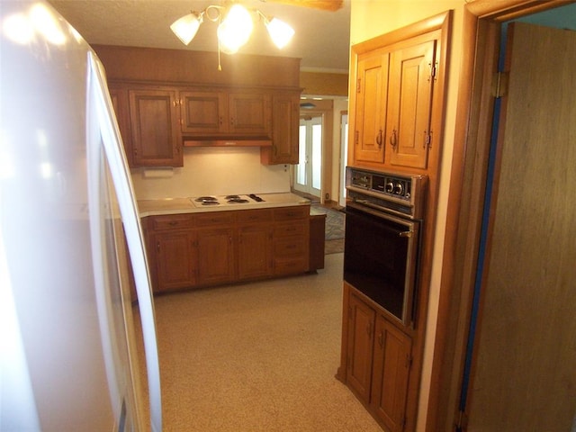 kitchen featuring ceiling fan and white appliances