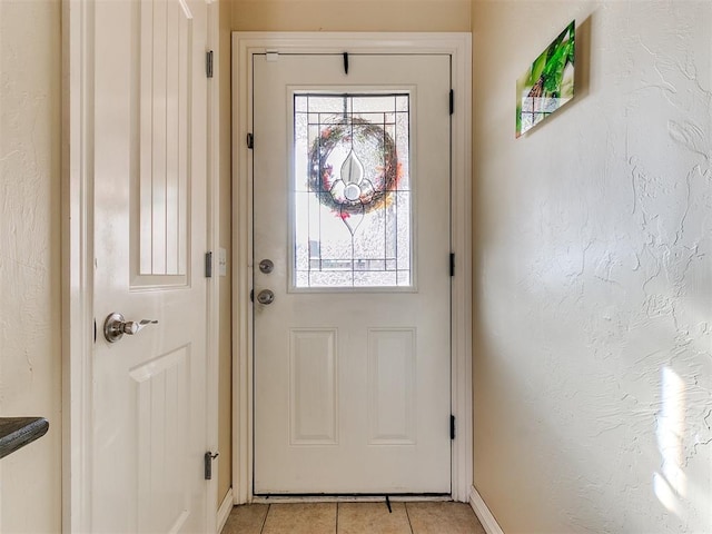 doorway featuring light tile patterned flooring