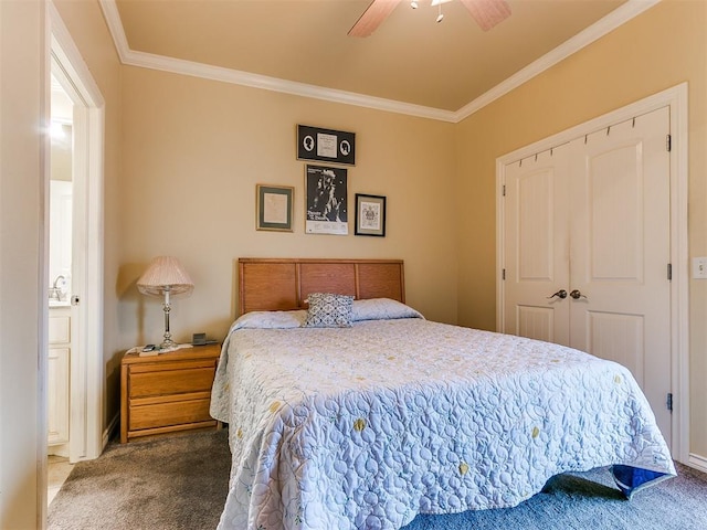 bedroom with connected bathroom, ceiling fan, crown molding, carpet floors, and a closet