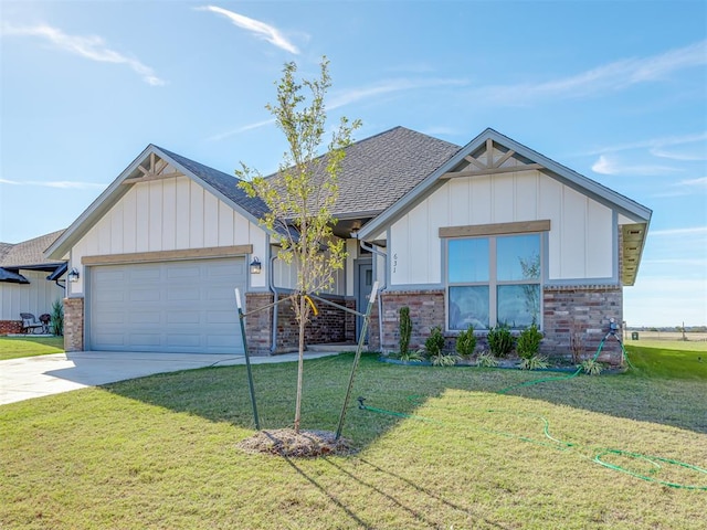 view of front of house with a garage and a front yard