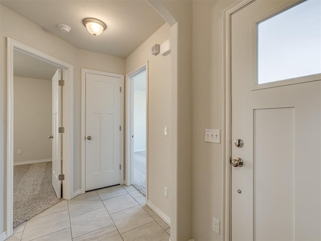 view of carpeted entrance foyer