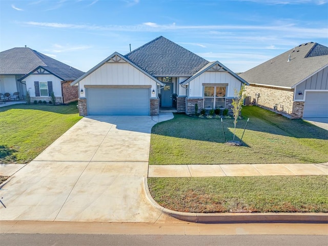 view of front of property featuring a garage, a front yard, and central AC