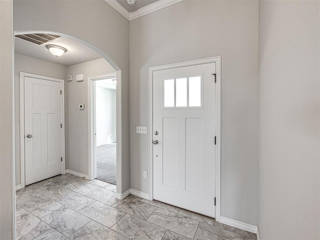 foyer entrance with ornamental molding