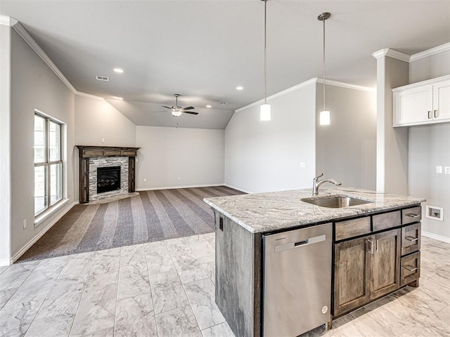 kitchen with ceiling fan, sink, a center island with sink, dishwasher, and white cabinetry