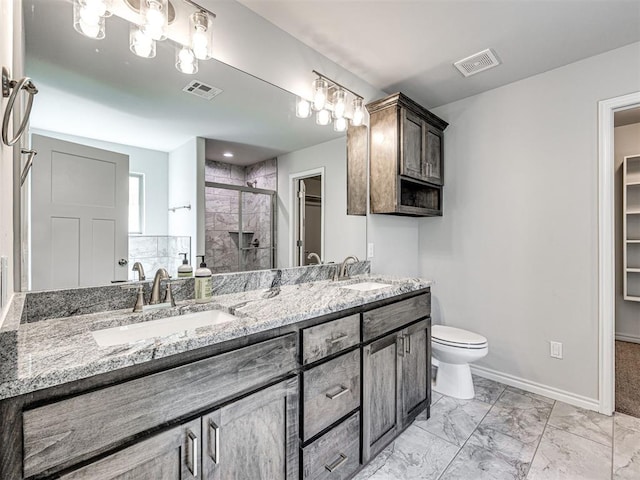 bathroom featuring vanity, toilet, and walk in shower