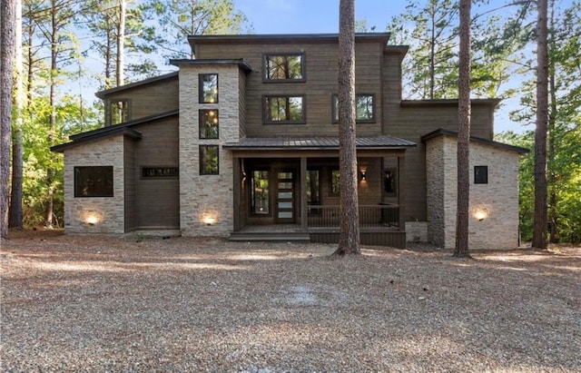 back of house featuring covered porch