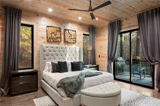 bedroom featuring access to outside, multiple windows, ceiling fan, and wood ceiling