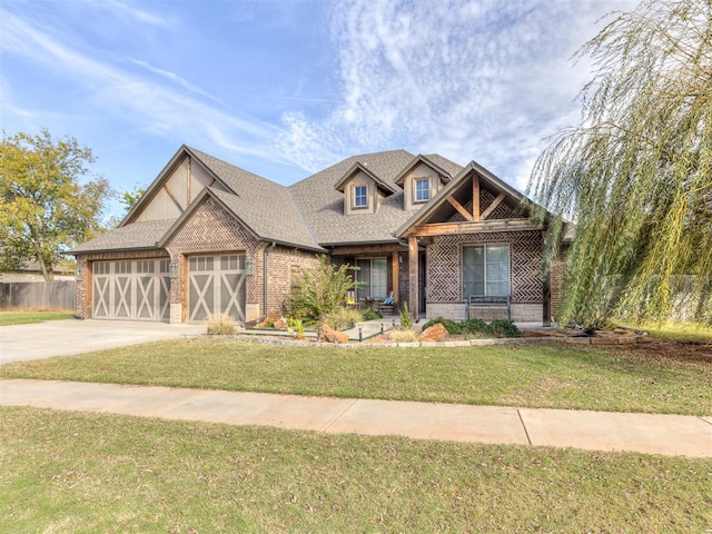 view of front of home featuring a garage and a front lawn