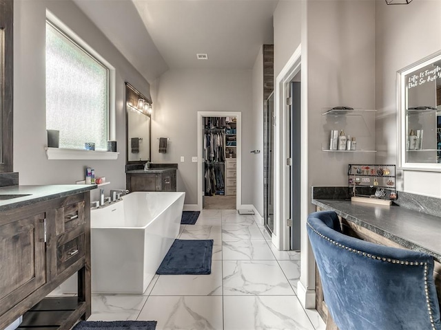 bathroom featuring vanity and plus walk in shower