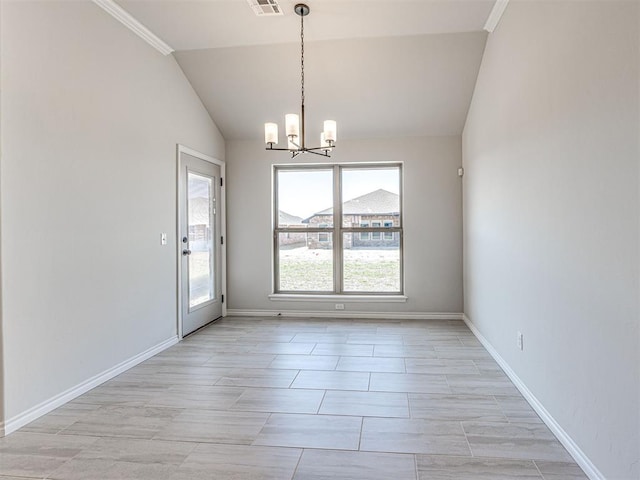 unfurnished dining area with a chandelier, lofted ceiling, and ornamental molding